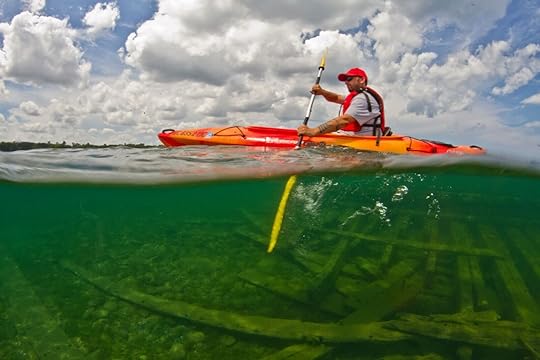 Person kayaking in Michigan on Harbor Beach 