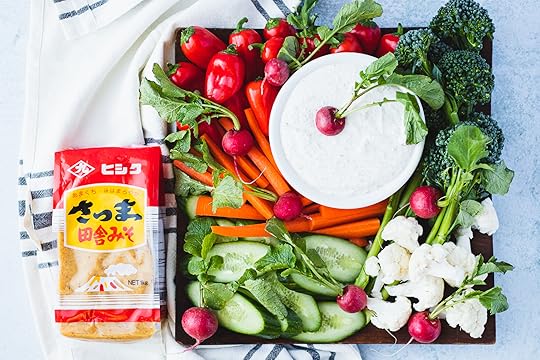 square platter of raw cut veggies with round bowl of miso ranch dip