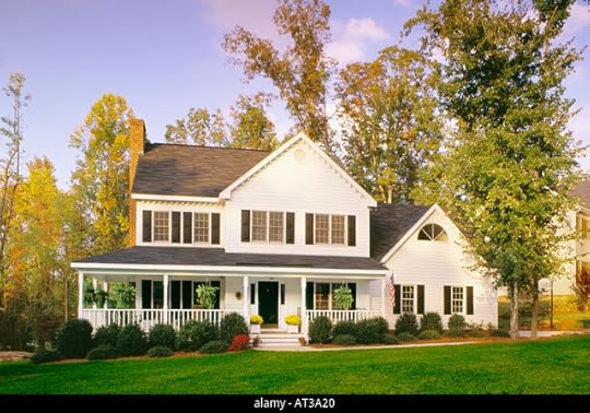 Large white house with black trim and a large front porch ...