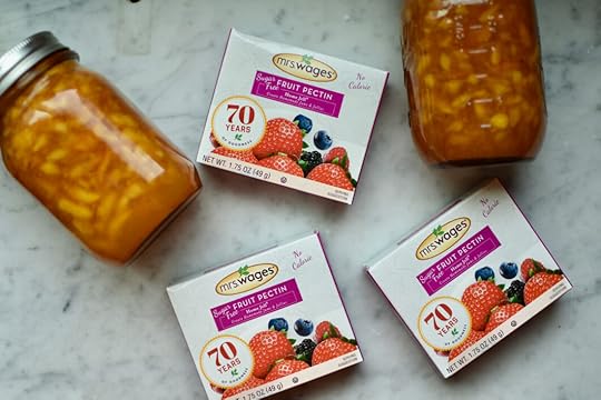 Two pint jars of sugar free peach jam and three boxes of Mrs. Wages Sugar Free Fruit Pectin Home Jell