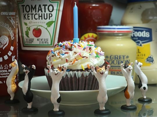 Attack Cats gashapon guarding a cupcake in the refrigerator