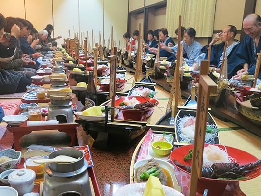 Photos of Japanese bus tour eating dinner at traditional inn