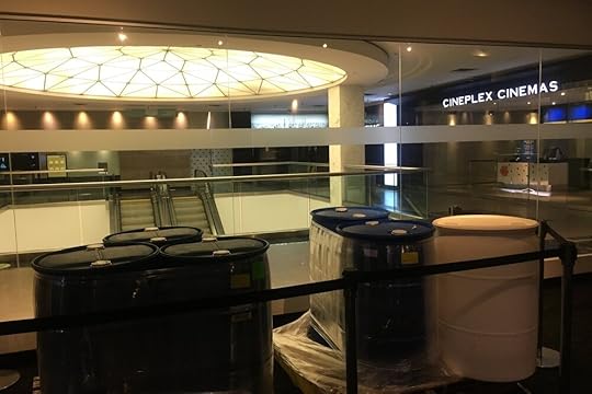 The Hell Plaza Octoplex, movie night, Oct. 8, 2020. In the foreground: drums of sanitizer where the lounge used to be.