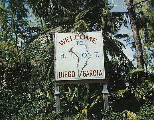 Sign surrounded by jungle foliage: Welcome to Diego Garcia, B.I.O.T