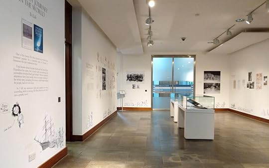A wide shot of Sarah Airriess' graphic novel show in the temporary exhibit space at the Polar Museum