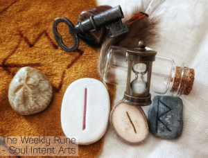 Elder Futhark runes Raidho carved into a silver clay tiles, with Isa carved into a reindeer antler slice and Isa again, carved into a porcelain tile. These, along with a wee hourglass and fossilized sea urchin rest with an old key and feather on a white and beige background
