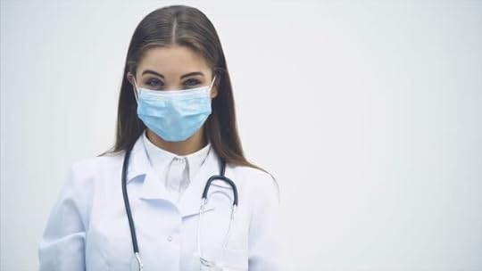 A young and beautiful doctor in a library smiling happy and holding books after doing a search and after studying. Free Stock Video Footage Download Clips expertise