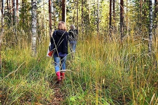 Two women, mother and daughter, gone mushroom foraging. The Finnish mushroom season extends roughly from early May to late November. Only pick mushrooms that you can definitely identify as edible