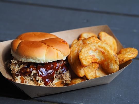 cardboard dish holding pulled pork sandwich