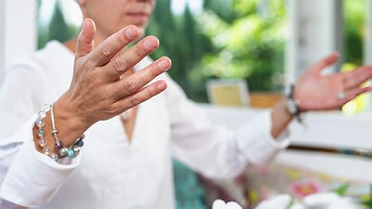woman in white shirt holding arms out
