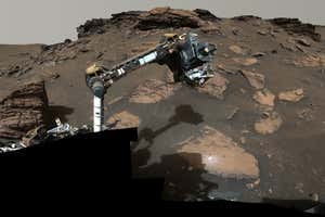 NASA?s Perseverance rover puts its robotic arm to work around a rocky outcrop called ?Skinner Ridge? in Mars? Jezero Crater. Composed of multiple images, this mosaic shows layered sedimentary rocks in the face of a cliff in the delta, as well as one of the locations where the rover abraded a circular patch to analyze a rock?s composition. Credits: NASA/JPL-Caltech/ASU/MSSS
