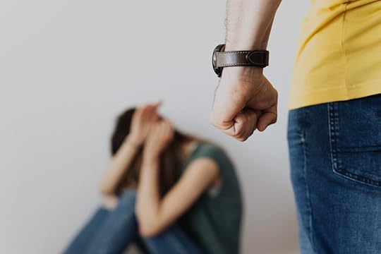 woman cowering from abuser, guilt, false guilt