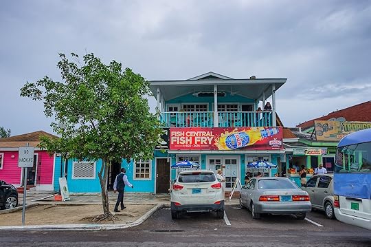 Nassau, Bahama - September 21/2019: Views of Arawak Cay Fish Fry village,of hand painted colorful structures providing Caribben fish food and drinks along the beach shore.