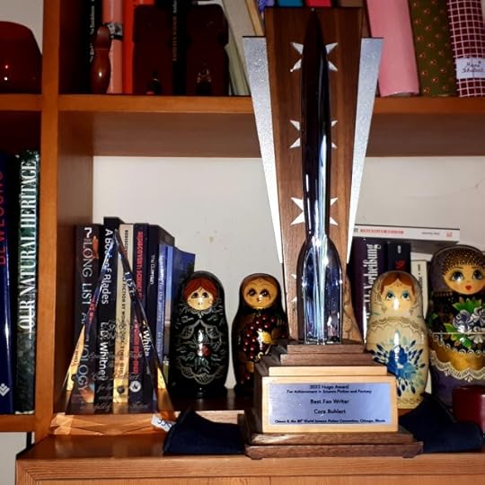 Space Cowboy Award and Hugo Award on the shelf