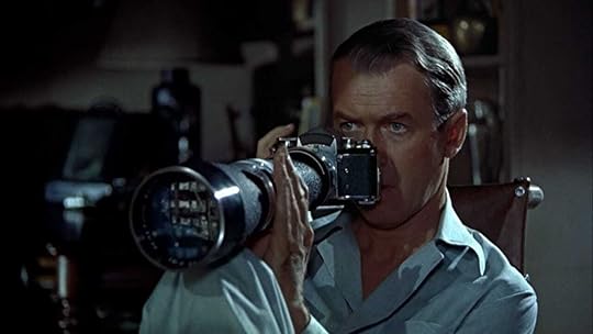 Jimmy Stewart holding a camera in Hitchcock's 