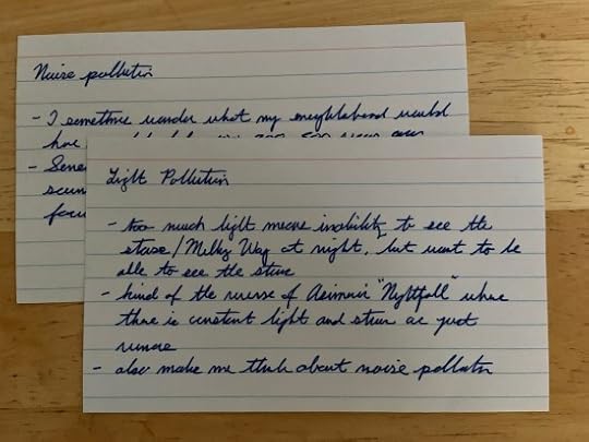 Some reading notes on index cards.