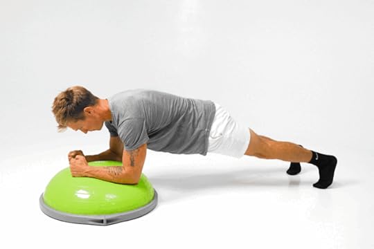 Man doing a plank on a BOSU ball