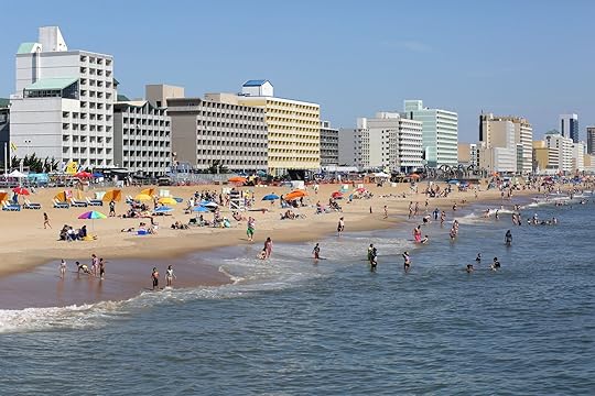 Virginia Beach, Virginia USA: June 2, 2018: On a beautiful summer day tourist who visit the resort city of Virginia Beach have fun in the water and on the sand.