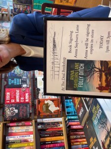 Photo of Anna signing books in the Deal Bookshop