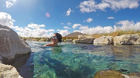 woman at nevada kirch hot springs in bright blue water