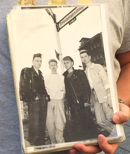 Photo of Depeche Mode under the Stresemannstrasse sign in Berlin