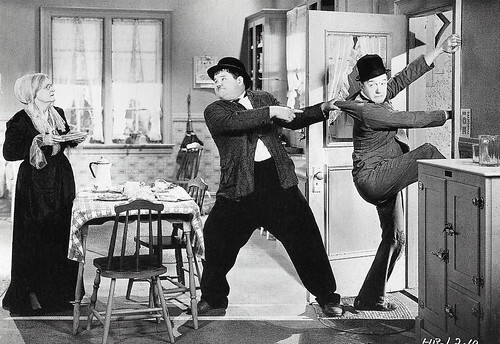 Stan Laurel and Oliver Hardy in One Good Turn (1931)