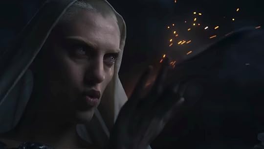 The Dweller blows embers from her hands to burn the Harfoots carts on The Rings of Power