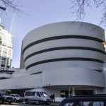 parked cars near concrete building
