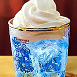 Japanese soda topped with soft serve ice cream ramune flavor