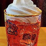Japanese soda topped with soft serve ice cream watermelon flavor