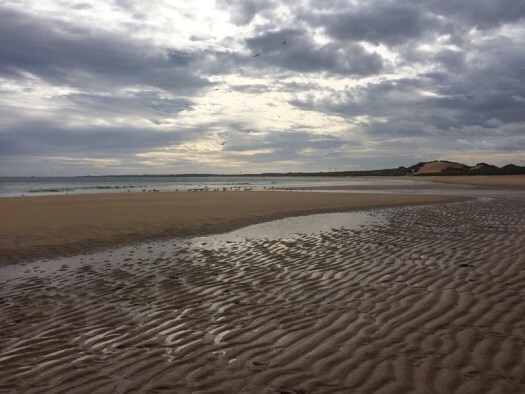 clouds gather over the beach: sometimes the sea wears wonderful colours