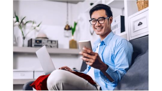 young employee looking at earned wage access app on smartphone