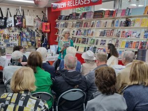 House of Jewels series author Amber Jakeman gives a reading at the series launch at Galaxy Bookshop above Abbeys Bookshop in Sydney's CBD.