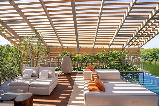 rooftop of the lagoon villa at the banyan tree mayakoba with lounge chairs and pool