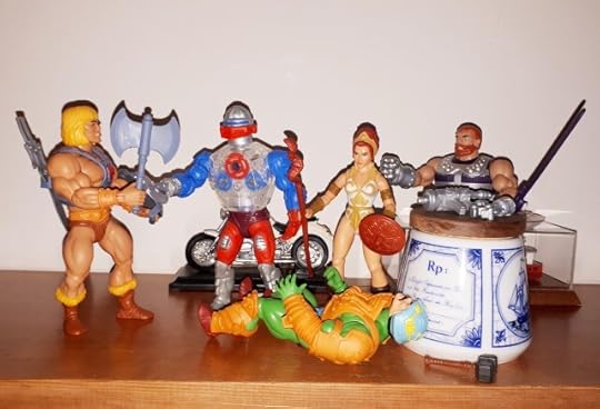 Duncan is down and Roboto attempts to stop He-Man.