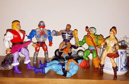 Faker is down and Adam, Roboto, Fisto, Duncan and Teela stand over his body.