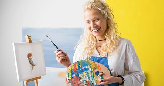 happy blonde painter with paint