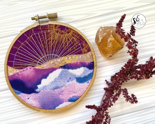maroon and gold fabric embroidered mountain scene