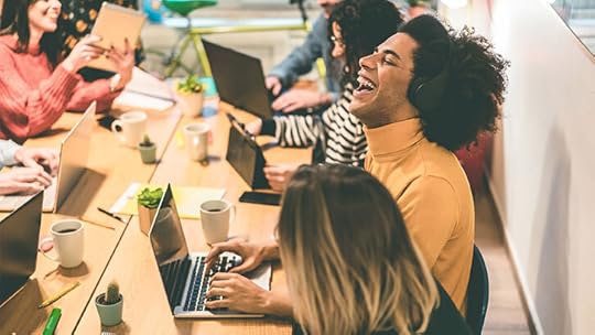 Young multiracial people having fun working inside coworking office