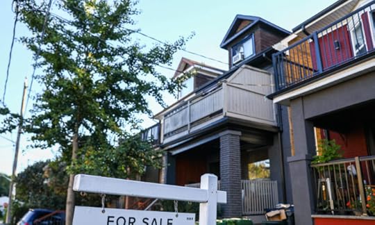 A for sale sign is displayed in front of a house in the Riverdale area of Toronto on Sept. 29, 2021. (The Canadian Press/Evan Buhler)