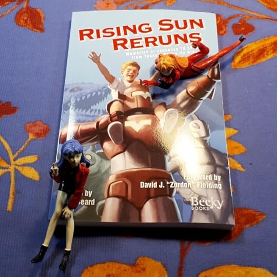 Asuka and Misato from Neon Genesis Evangelion pose with Rising Sun Reruns.