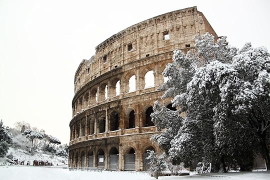 best time to visit italy snow in rome on colosseum