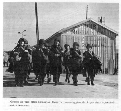 Nurses of the US 48th Surgical Hospital marching from the Arzeu docks, Algeria, 9 November 1942 (US Army Medical Department)