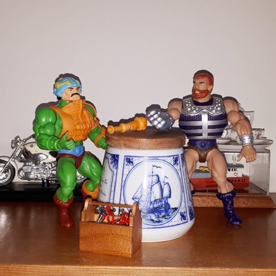 Duncan is tinkering with his mace while Fisto looks on.