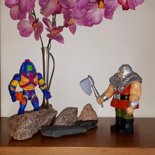 Man-e-Faces and Ram-Man are cleaning up rocks.