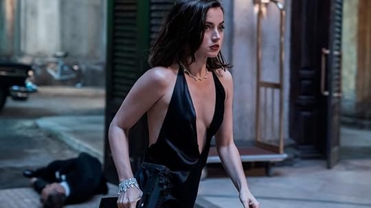 Ana de Armas will lead the John Wick spin-off Ballerina, de Armas in a dress and a gun