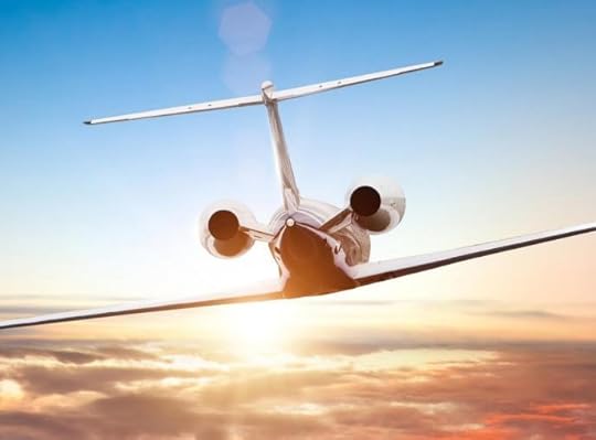 A plane flying in the skyDescription automatically generated with low confidence