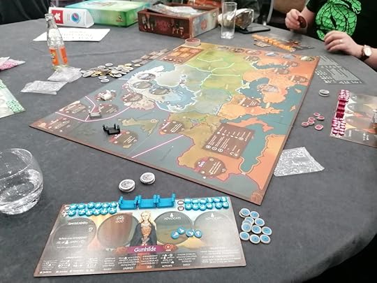 Pax Viking set up on a table with drinks and other items scattered around it