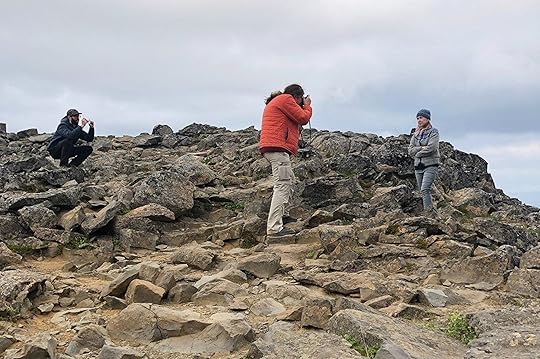 At the top of a volcanic core. I'm wearing an EMS summit jacket on top of my lopi. Before we went someone said "pack for all weathers because you will experience all of them" and that was true. it was hot, it was cold, it was dry, it was soaking. The summit jacket packs into its own pocket and you can use it as a pillow. It was a fantastic investment. Mine is stuffed with polar fleece, which is an inorganic down alternative. 