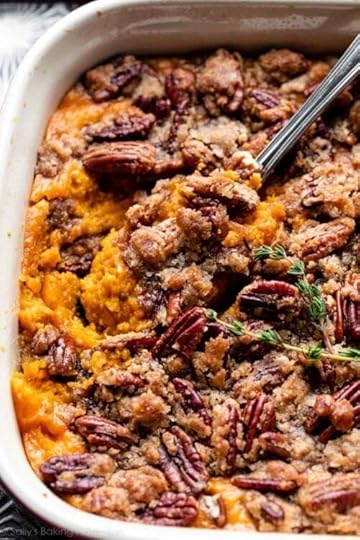 dish of sweet potato casserole with a serving spoon.